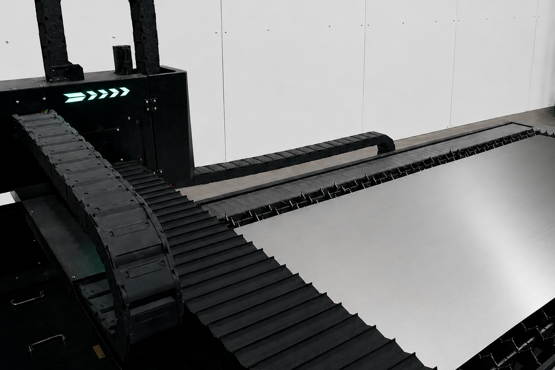CNC laser gantry and cable chain detail with sheet metal loaded